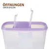 Close-up of the top of a clear plastic storage container with a purple lid and two open compartments. Anteprima dell’immagine prodotto