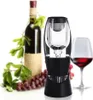A wine aerator is shown in front of a bottle of wine, a glass of wine, and grapes. Produktbild-Vorschau