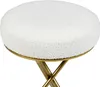 A close-up view of a round, white bouclé ottoman with gold metal legs. Produktbild-Vorschau