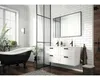 A modern bathroom with a black bathtub, a white vanity with a mirror, and white subway tiles. Náhled obrázku produktu