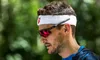 A man wearing sports sunglasses and a headband outdoors. Náhled obrázku produktu