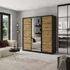 A modern bedroom or living room setting with a large wardrobe, sofa, and floor lamp. Produktbild-Vorschau