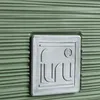 A close-up of a green planter with a gray logo. Produktbild-Vorschau