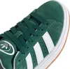 A close-up view of the toe and laces of a green Adidas sneaker. Produktbild-Vorschau
