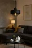 A living room scene with a sectional sofa, coffee table, and a pendant lamp. Náhled obrázku produktu
