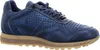 A side view of a blue leather sneaker with perforations and a tan sole. Voir les images du produit