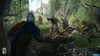 A group of medieval warriors fighting in a swampy forest with a building in the background. Produktbild-Vorschau