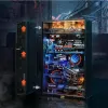 A detailed, illuminated model of a futuristic city scene inside a computer tower-like structure, with a side panel open to reveal the intricate details. Produktbild-Vorschau