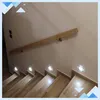 A wooden handrail and illuminated steps on a staircase. Náhľad obrázku produktu