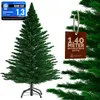 A green artificial Christmas tree with a brown tag hanging from a branch. Náhled obrázku produktu