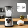 A blender filled with ice cubes on a wooden countertop, with a bowl of crushed ice and a fruit basket in the background. A graphic indicating temperature range is also visible. Anteprima dell’immagine prodotto