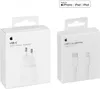 Two white Apple product boxes are shown side-by-side against a white background. The box on the left contains a USB-C 20W Power Adapter, and the box on the right contains a USB-C to Lightning Cable. Produktbild-Vorschau