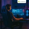 A person playing a video game in a dimly lit room with blue and purple lighting. Produktbild-Vorschau
