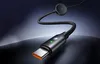 A close-up shot of a black USB-C charging cable with a small circular magnetic attachment at the other end, set against a dark, gradient background. Podgląd zdjęcia produktu