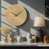 A wall clock and decorative items are displayed on a shelf. Produktbild-Vorschau