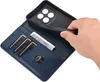 A hand is shown inserting a phone into a blue leather wallet case. The case has slots for cards and a bill. Produktbild-Vorschau