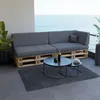 A modern outdoor seating area with a pallet sofa and coffee tables overlooking the ocean. Produktbild-Vorschau