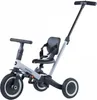 A studio shot of a gray and black children's tricycle with a parent push handle. Podgląd zdjęcia produktu