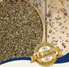 A wooden bowl filled with hemp seeds, with some seeds scattered on a wooden surface. A golden banner with text is overlaid on the image. Produktbild-Vorschau