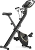 A black and gold folding exercise bike is shown against a white background. Náhľad obrázku produktu