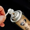 A hand is holding a white applicator tube over the nozzle of a spray can. Anteprima dell’immagine prodotto