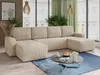 A modern living room with a large U-shaped sectional sofa, coffee table, and large windows.