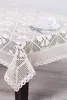 A close-up, diagonal view of a crocheted tablecloth on a table. Náhľad obrázku produktu