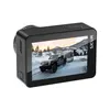 An action camera displaying a scene of a jeep towing a trailer through a snowy landscape. Anteprima dell’immagine prodotto
