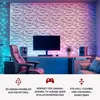 A modern room with 3D wall panels, a computer setup, and ambient lighting. Produktbild-Vorschau