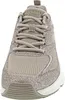 A close-up front view of a beige Skechers sneaker. Voir les images du produit