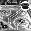 A close-up view of a stainless steel RV stove with a rubber foot highlighted in a circular inset. Produktbild-Vorschau