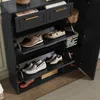A shoe cabinet with multiple shelves and drawers, displaying various shoes. Produktbild-Vorschau