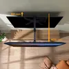 A TV mount is shown from a top-down perspective, with dimensions indicated by orange arrows and text. Produktbild-Vorschau