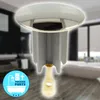 A close-up of a drain plug with a blurred bathroom in the background. Produktbild-Vorschau