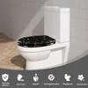 A toilet seat with a black and gold marble pattern is shown on a white toilet in a bathroom setting. Produktbild-Vorschau