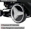 Close-up of a lawnmower wheel and part of the engine, with marketing text overlays. Produktbild-Vorschau