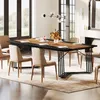 A dining room scene with a large wooden table and chairs, set for a meal. Náhled obrázku produktu