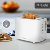 A white Zeegma toaster with two slices of toast in it, placed on a kitchen counter with some bread slices and jam in the foreground. Anteprima dell’immagine prodotto