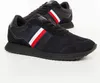 A pair of black Tommy Hilfiger sneakers shown from a diagonal angle on a white background. Náhled obrázku produktu
