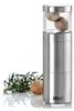 A nutmeg grater with nutmeg and rosemary on a white background. Produktbild-Vorschau