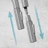 Close-up of a kitchen faucet being assembled or disassembled, with arrows indicating movement. Produktbild-Vorschau