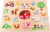 A wooden peg puzzle featuring various farm animals and objects. Náhľad obrázku produktu