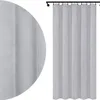 A gray curtain hanging from a curtain rod. Produktbild-Vorschau