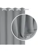 A close-up view of a gray curtain with grommets, hanging from a curtain rod. Produktbild-Vorschau