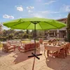 An outdoor patio scene with furniture and a large umbrella. Produktbild-Vorschau