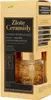 The image shows the retail packaging of a skincare product, specifically a serum in a glass jar with gold flakes inside. Podgląd zdjęcia produktu