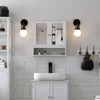 A bathroom vanity with a medicine cabinet, sink, and faucet. Náhled obrázku produktu