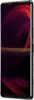 A smartphone with a vibrant, abstract wallpaper displayed on its screen, shown from a side angle. Produktbild-Vorschau