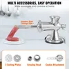 A manual meat grinder with sausage stuffing tube and various attachments, set against a light background with kitchen utensils in the background. Podgląd zdjęcia produktu