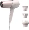 A white and rose gold Philips hair dryer with three attachments. Produktbild-Vorschau